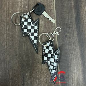 Nouveau porte-clés en cuir véritable à motif à carreaux noir et blanc, fait à la main, avec un éclair, vente en gros, accessoire pour sac - Product Image 1