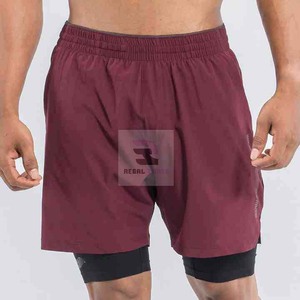 Pantalones cortos deportivos de doble capa con logotipo personalizado unisex con patrón sólido de cintura elástica y decoración informal de encaje - Product Image 3