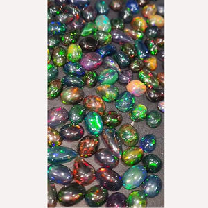 269ชิ้นของโอปอลสีดำจากเอธิโอเปียธรรมชาติที่มีไฟ9มม. ถึง15มม. ลูกแพร์รูปไข่ Cabochon 497 CTS iroc ขายอัญมณี CAB เรา $796สำหรับทุกคน - Product Image 1