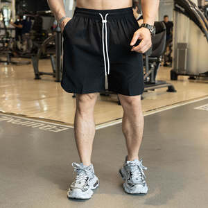 Light Men Gym Shorts Logotipo personalizado Blanco y verde fluorescente Pantalones cortos para correr - Product Image 1