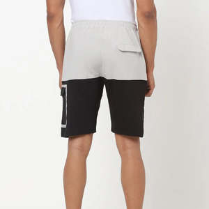 กางเกงขาสั้นออกกำลังกายผู้ชายคุณภาพสูง ผลิตจากโพลีเอสเตอร์ เป็นมิตรต่อสิ่งแวดล้อม เหมาะสำหรับฤดูร้อน สวมใส่สบาย ระบายอากาศได้ดี เอวยางยืด สีพื้น ใหม่และย้อมสีเรียบ - Product Image 3