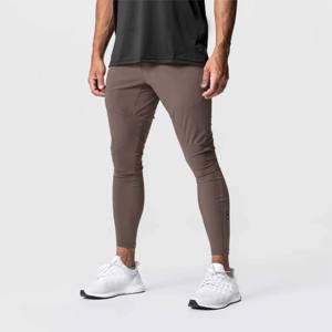 Pantalons de jogging pour hommes - Pantalons d'entraînement extensibles et à séchage rapide pour les entraînements de haute intensité et la course à pied - Product Image 1
