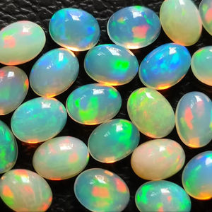 Opales éthiopiennes blanches naturelles 6x4mm de forme ovale Welo Opal Cabochon Cut Pierres pour bijoux Loose Multi Fire White Opal Cabs - Product Image 3