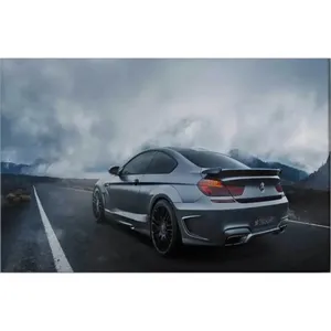 Impression sur toile de la BMW Série 6 grise Fida sur une route de montagne brumeuse - Product Image 6