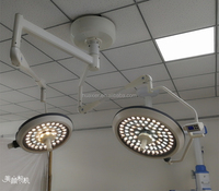 Lampe de modèle chirurgicale à double dôme électrique à LED sans ombre pour un fonctionnement optimal.