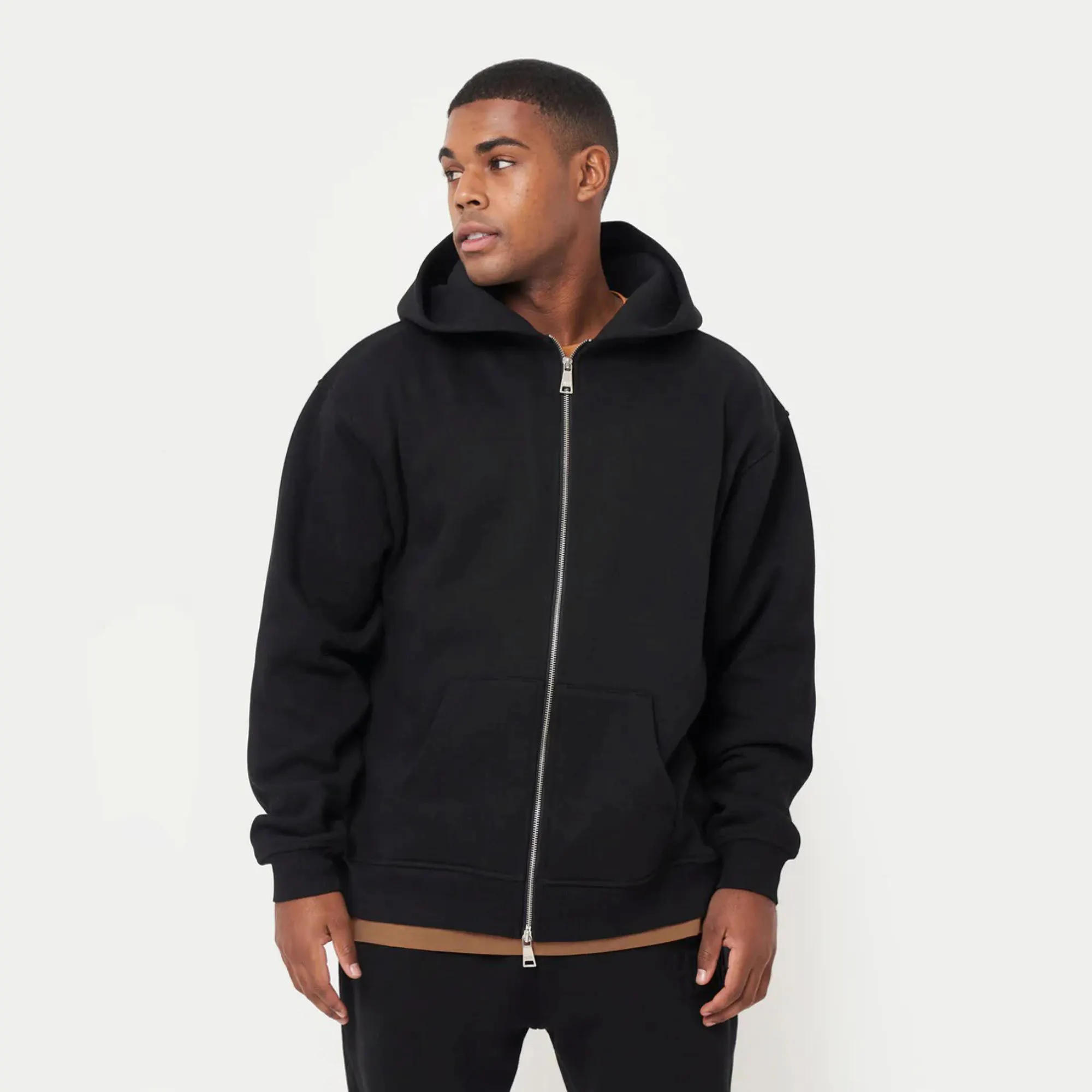 80% Cotton 20% Polyester Dropped shoulders Zip-front style Kangaroo Pockets Ribbed hem and cuffs Black Oversized Hoodie