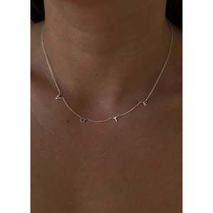 <b>Initial</b> Silver Necklace for Votive Occasions Featuring Unique Letter Shape - Product Image 2
