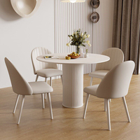 Ensemble table et chaises de salle à manger de style crème luxe léger, ovale, moderne, simple, blanc pur, avec plateau de table assemblé, en pierre