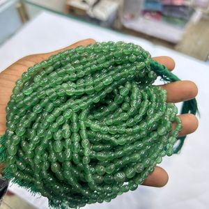 ลูกปัดหินควอทซ์สตรอเบอรี่ธรรมชาติทรงรีสีเขียว - Product Image 1