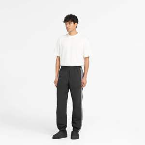 <span class=keywords><strong>Pantaloni</strong></span> da ginnastica in Nylon leggero per uomo <span class=keywords><strong>con</strong></span> un elegante Design atletico <span class=keywords><strong>con</strong></span> <span class=keywords><strong>elastico</strong></span> in vita e polsini <span class=keywords><strong>alla</strong></span> <span class=keywords><strong>caviglia</strong></span> disponibili in nero tutte le taglie - Product Image 4