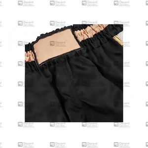 กางเกงขาสั้นแบบแห้งเร็วสำหรับทุกเพศกางเกงขาสั้นแบบคาร์โก้สีทึบเอวปานกลางแนวสปอร์ตแบบลำลอง - Product Image 3