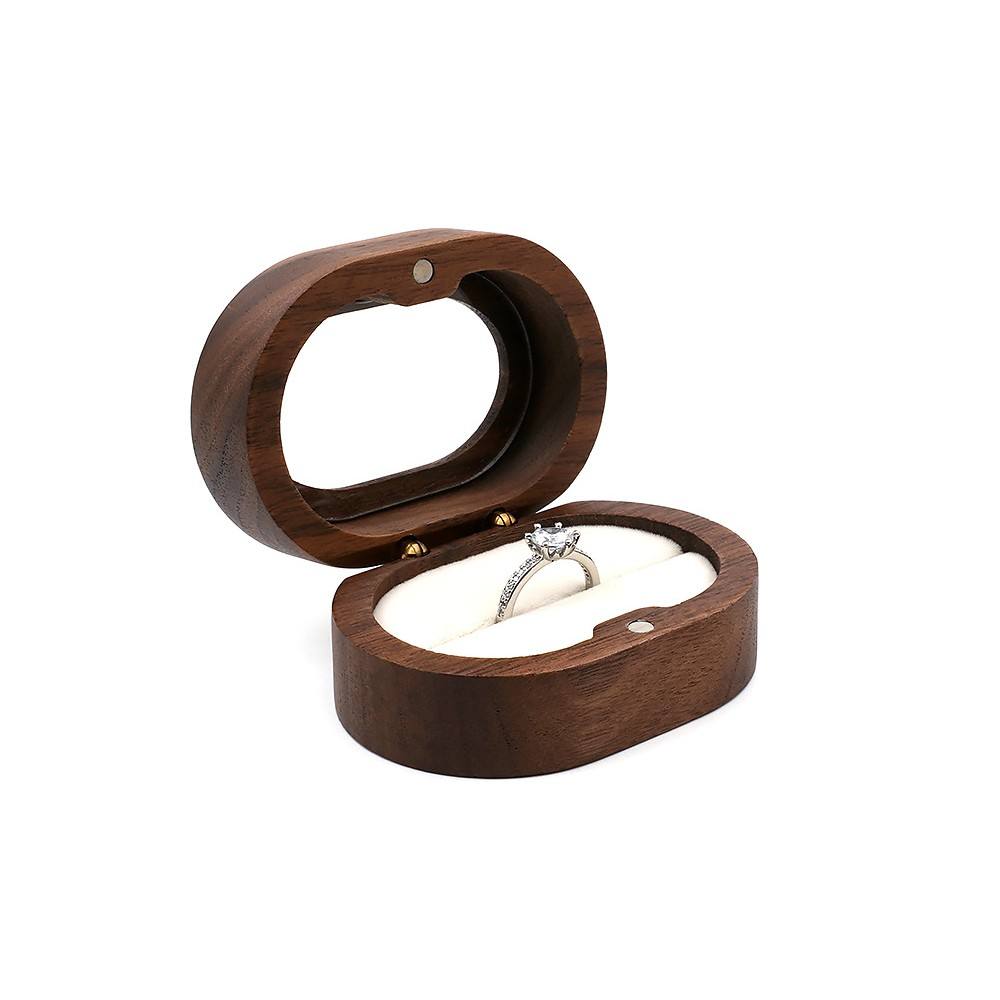 White oval transparent lid ring box