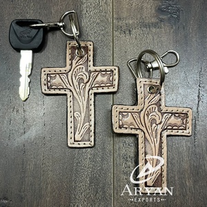 พวงกุญแจหนังวัวแท้ทำมือคุณภาพสูง ดีไซน์ใหม่ล่าสุดปี 2025  รูปทรงกากบาท  แฟชั่นทันสมัย เหมาะสำหรับเป็นของขวัญสำหรับทุกเพศ - Product Image 1