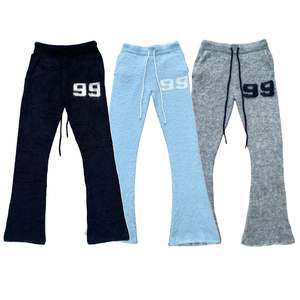 Pantalones de chándal acampanados informales de algodón 100% personalizados OEM al por mayor-Pantalones tejidos borrosos de invierno ecológicos para hombre con logotipo personalizado - Product Image 1