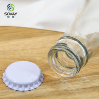 Vente en gros de bouteilles en verre vides de 250 ml avec capsules couronne pour cola/jus de fruits/boissons gazeuses