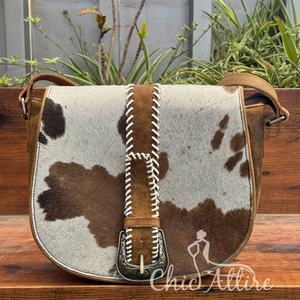 ใหม่กระเป๋าถือพาดลำตัวหนังวัวสำหรับผู้หญิงกระเป๋าสะพายไหล่สำหรับเดินทางมีลวดลายที่ไม่ซ้ำใครพร้อมหัวเข็มขัดตะเข็บวิปทิชกระเป๋าทรงอานม้าแบบวินเทจ - Product Image 1