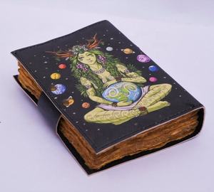 Agenda de cuero artística de diseño exquisito con una ilustración mística de la Diosa de la Tierra rodeada de planetas y estrellas - Product Image 1