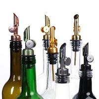 Verseur de bouteille d'huile et de miel de liqueur de vin lisse en acier inoxydable stocké avec des couleurs d'or