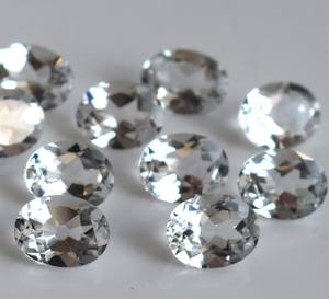 บุษราคัมสีขาวธรรมชาติทรงรีตัดขนาด10x12มม. เป็นรูปวงรีหลวมสีขาวบุษราคัม - Product Image 1