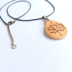 Coconut Shell Teardrop Necklace with <b>Lotus</b> Design - Handmade & Eco-Friendly | Viet Fargimex - Product Image 2