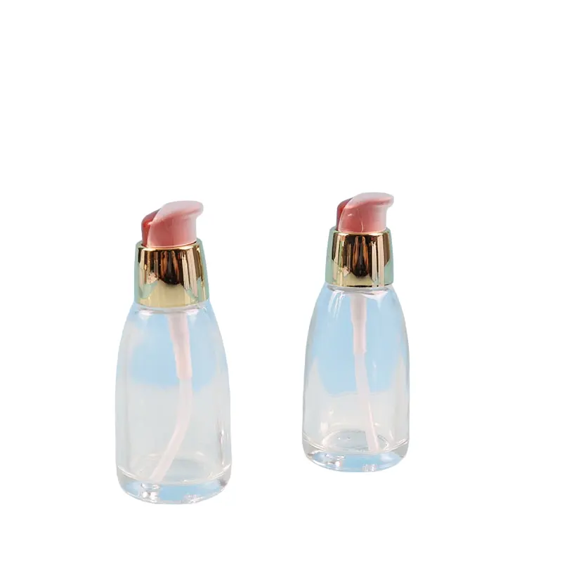 Stock de fábrica Botella de suero de 30ml Botella de base prensada Loción Crema Botella transparente