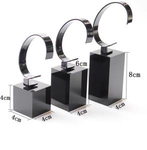 Elegant <b>Black</b> and White Acrylic Watch Display Stand with Block Base for Retail Showcases, Exhibitions, and Personal Collections - Product Image 1