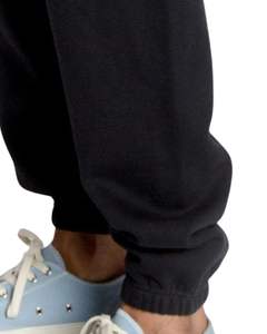 Pantalones deportivos unisex de felpa negra, estilo casual, con cintura elástica y puños en los tobillos, de algodón grueso. - Product Image 6