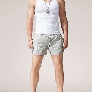 กางเกงขาสั้นแห้งเร็วเป็นมิตรกับสิ่งแวดล้อมสำหรับผู้ชายเอวยางยืดแบบลำลองระบายอากาศได้ดีสีพื้นแบบกำหนดเอง100% - Product Image 2