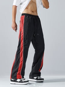 Pantalon de survêtement élégant pour homme, coupe ample et large, avec empiècements contrastants noir et blanc, taille à cordon de serrage, confortable pour le quotidien - Product Image 4