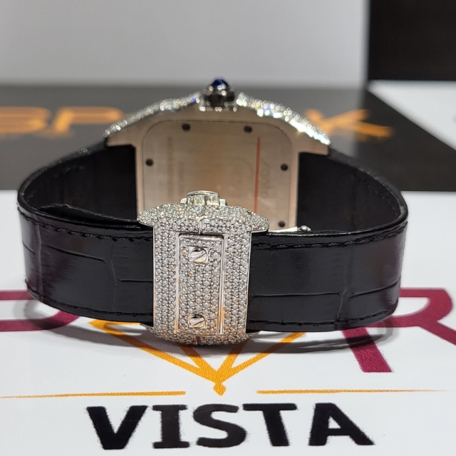 silver mechanical watch with a black dial