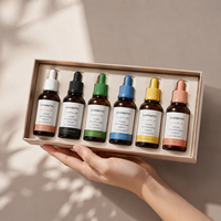 Flacon d'huile essentielle ambrée personnalisé de 30 ml, récipient en verre pour sérum avec bouchons pastel multicolores, collection de marques de niche OEM ODM OBM