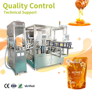Machines de remplissage et de bouchage rotatives entièrement automatiques pour bouteilles de miel liquide industrielles avec buses anti-goutte de précision - Product Image 1
