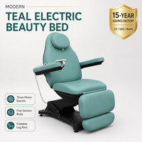 Table de beauté électrique avec base bleu sarcelle et noir mat, trou pour le visage, dossier inclinable à trois moteurs, repose-jambes pliable en cinq sections