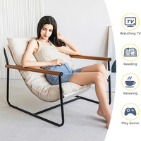 Fauteuil de détente réglable avec structure métallique robuste, dossier solide et coussin en peluche pour salon moderne