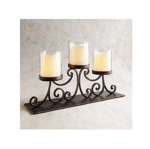 Portavelas de metal premium para velas de té, creado para realzar la belleza de la luz suave y añadir una elegancia decorativa refinada a los hogares. - Product Image 1