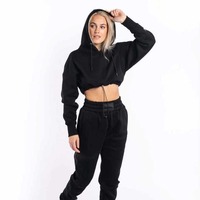 Ensemble sweat à capuche court noir pour femme 2026, manches longues, couleur unie, tricot décontracté en coton, capuche à cordon, pantalon assorti, hiver