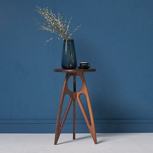Elegant round wood <b>side</b> <b>table</b> with fluted base and smooth top designed for home or office interiors - Product Image 1