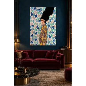 Fida Woman in Gold Patterned Dress on Blue Leaf Background <b>Canvas</b> Print - Product Image 1