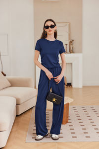 Conjunto de camiseta y pantalón acampanado de chándal para mujer más vendido, nuevo diseño personalizado, Material transpirable de alta calidad, patrón sólido - Product Image 5