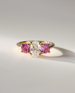 IGI Certified Oval Cut Lab Grown Diamond Three Stone Engagement Ring with <b>Pink</b> Side Stones in 9K Yellow/White & Rose Gold - Product Image 1