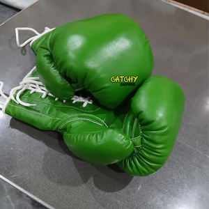 นวมชกมวยหนังพรีเมียมพร้อมสายรัดข้อมือ ดีไซน์ดูดซับแรงกระแทกสำหรับการฝึกซ้อมและการแข่งขัน - Product Image 5