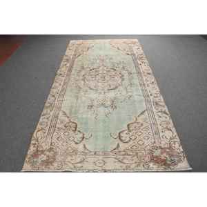 Tapis vintage 4,7 x 9,3 pieds, grand tapis turc, tapis à imprimé animal brun et vert - Product Image 1