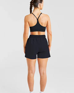 Short de survêtement taille moyenne pour femmes noir avec logo personnalisé de qualité supérieure avec poches Short de sport taille haute doux et respirant pour femmes - Product Image 4