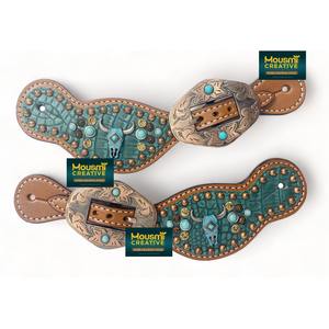 สายรัดอานม้าหนังแท้สไตล์ตะวันตกจากอาร์เจนตินา สำหรับผู้หญิง ลายหนังจระเข้สีเทอร์ควอยซ์ ประดับหัวกระทิง - Product Image 1