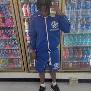 ชุดวอร์มกันลมผ้าไนลอนพิมพ์ลายแบบเรียบ น้ำหนักเบา ระบายอากาศได้ดี เป็นมิตรกับสิ่งแวดล้อม สะท้อนแสง 3 เมตร พร้อมโลโก้แบบกำหนดเองใหม่ - Product Image 5