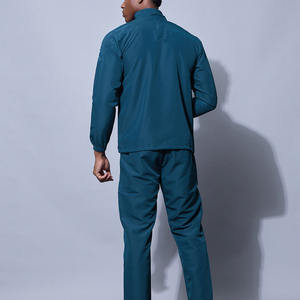 Survêtement athlétique bleu sarcelle pour homme, veste zippée à col montant avec motif géométrique sur les épaules et pantalon de jogging ajusté assorti, vêtements de sport - Product Image 6