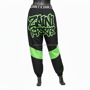 Pantalones Cortavientos Premium de 120 GSM para Mujer, Tela de Poliéster Suave, Paneles Negros y Verdes, Logotipo Personalizado por Transferencia de Calor - Product Image 2