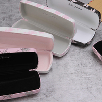 Étui à lunettes rigide portable en cuir PU de luxe avec imprimé feuilles tropicales personnalisé et badge métallique – Vente en gros