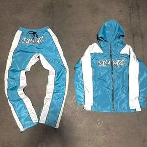 ชุดแจ็กเก็ตกางเกงกันลมสำหรับผู้ชายชุดวอร์มกันลมผ้าไนลอนผลิตจากโรงงานโดยตรง - Product Image 5