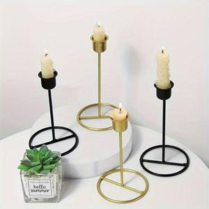 Lujoso candelabro de metal pulido dorado y negro, perfecto para mesas de comedor y salas de estar modernas - Product Image 1